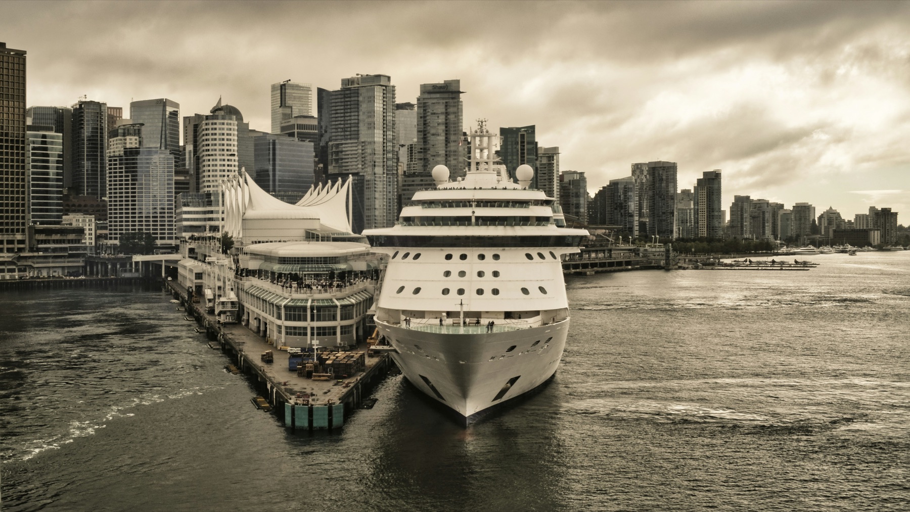 Cruise ship docked beside a city waterfront