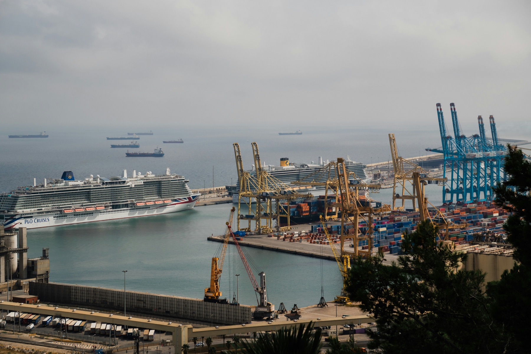 Cruise ship docked in a busy port
