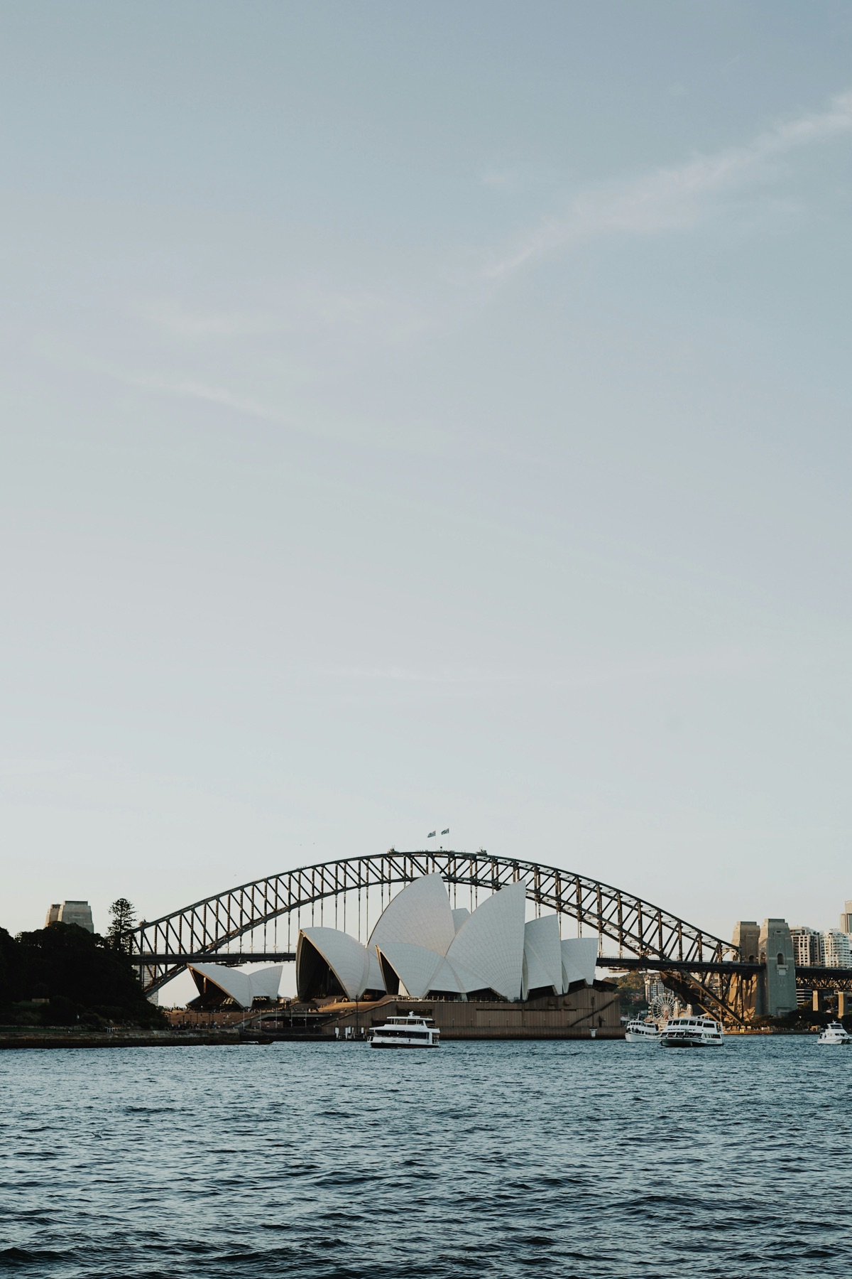 Sydney Opera House and harbour on a bright day